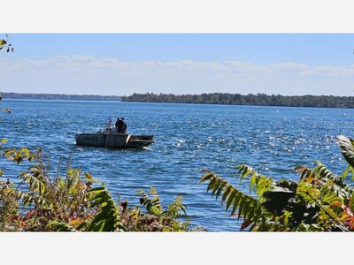 Vehicle drives into river